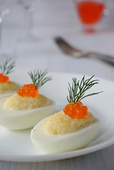 Stuffed eggs with caviar, cheese and mayonnaise