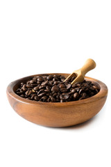 Coffee beans close-up in a wooden bowl of isolate on a white background