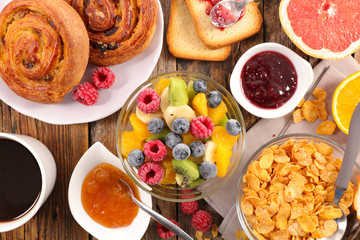 breakfast with fruit,croissant,cereal and coffee