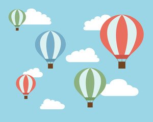 Flat design illustration of colorful flying hot air balloons on blue sky with white clouds