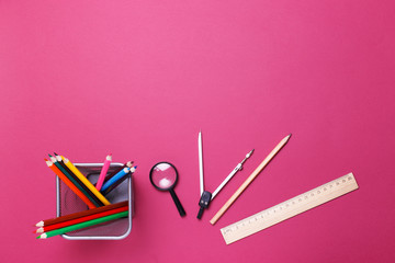 education concept - school supplies on the desk in the auditorium