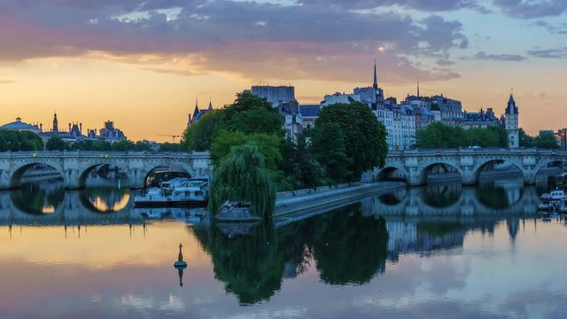 Sunrise over la Cite in Paris, France, with Pont Neuf and the river Seine. Colourful travel background. Romantic cityscape.