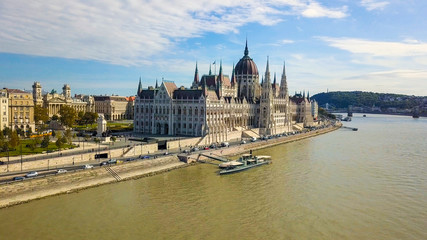 Fototapeta premium Aerial footage from a drone shows the historical Buda Castle near the Danube on Castle Hill in Budapest, Hungary. Bridge on the river. Aerial view.