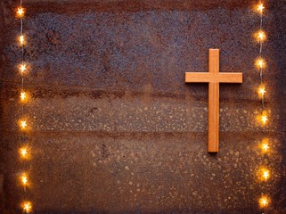 Wooden crucifix on rusty iron