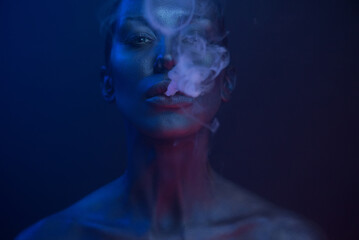 Vape Party, Nightlife. Beautiful Sexy Woman smoking