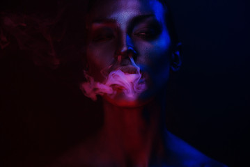 Vape Party, Nightlife. Beautiful Sexy Woman smoking