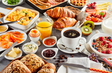 Huge healthy breakfast spread on a table - obrazy, fototapety, plakaty