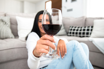 Beautiful young girl holding a wine glass