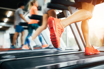 Picture of people running on treadmill in gym - obrazy, fototapety, plakaty
