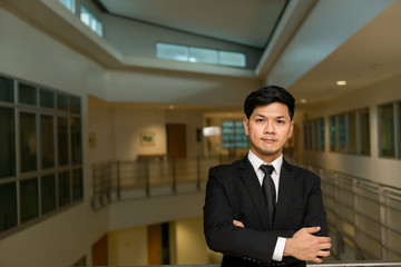 Fototapeta premium Portrait of Asian business man in the building in the evening