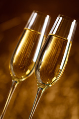 Gold scenery with two glasses of champagne for celebration important moments.