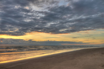 Naklejka premium Sunset at the beach