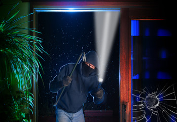 Burglar just pried open a sliding glass door into a residential house