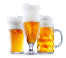 Mug of frosty light beer with foam isolated on a white background