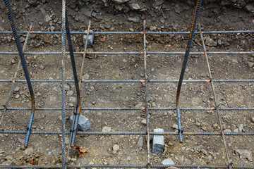 Construction site view of steel rebar grid for foundation, horizontal aspect