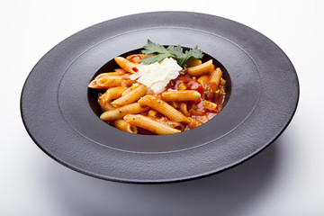 Beautiful macaroni with minced meat and vegetables on a plate. horizontal view from above