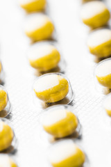 Pharmacy theme, yellow tablets.