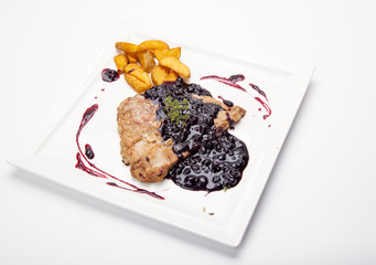 steak entrecote on pork bone with blueberry sauce. meat with berry sauce. delicious recipe. berry sauce