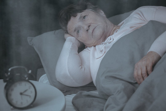 Elderly Woman Trying To Sleep