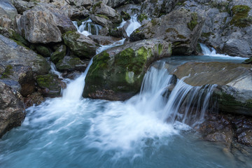 Mountain river and stones landscape natural environment. Hiking in the alps. Grawa Waterfall in Stubai Valley, Tyrol, Austria