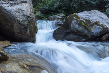 Fototapeta premium Mountain river and stones landscape natural environment. Hiking in the alps. Grawa Waterfall in Stubai Valley, Tyrol, Austria