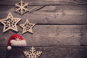 wooden snowflakes and srars on old dark background