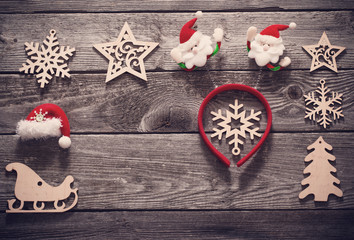Christmas decoration with little red hat on old wooden background