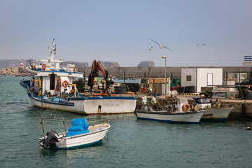Fototapeta premium Fishing boats in the port of Sagres in the southwest cape of Europe.
