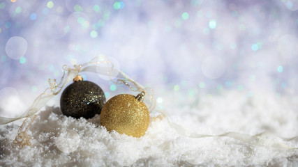 Christmas balls on Christmas snowy bokeh background