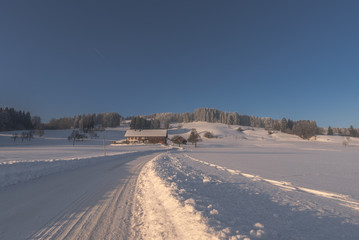 Winter dream, blue sky and the landscape is sinking in the snow