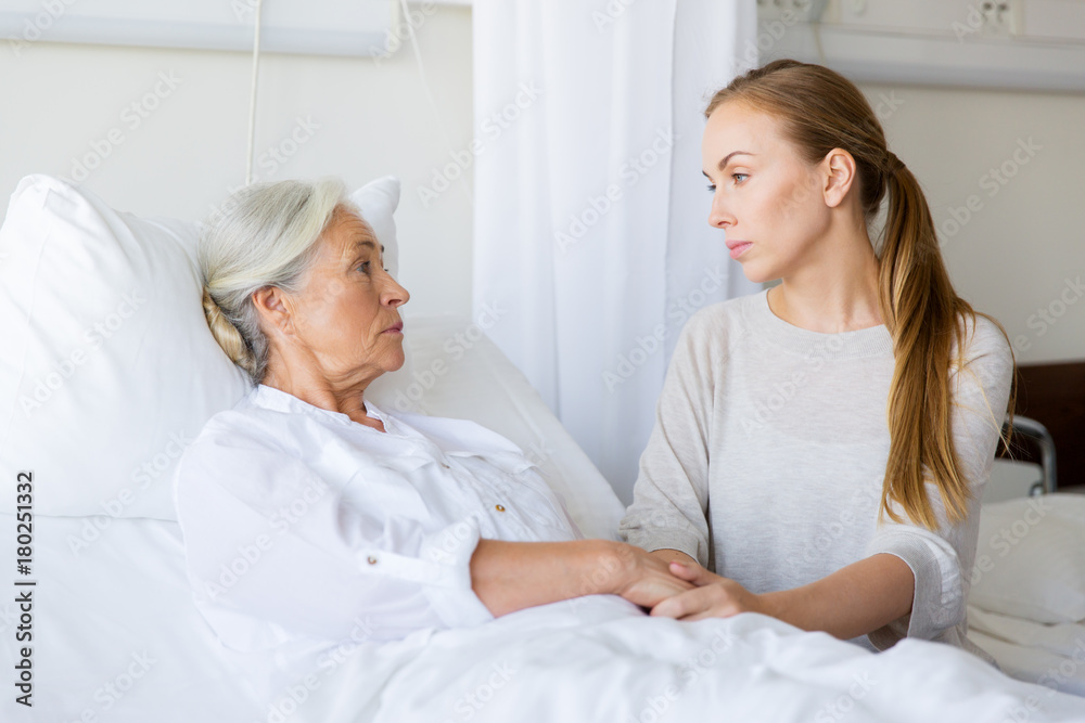 Wall mural daughter visiting her senior mother at hospital