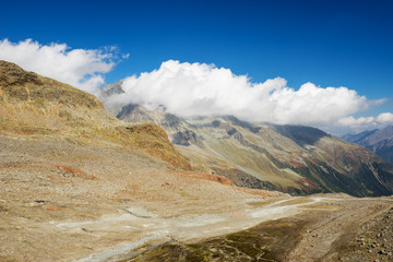 Mountains and peaks landscape. Stubaier Gletscher covered with glaciers and snow, natural environment. Hiking in the Stubai Alps. Ski resort in Tirol, Austria, Europe