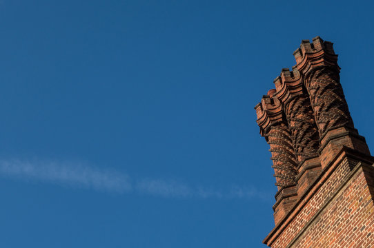 Detail Of Rooftop Ornament Red Brick Chimneys In Tudor Architecture