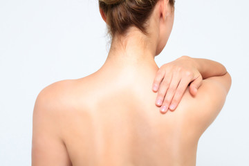 Woman massaging pain back