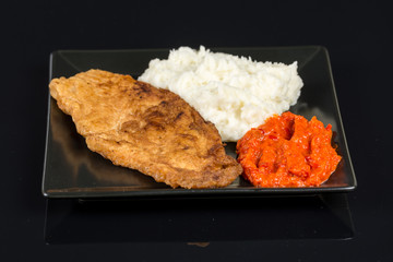 Fried chicken white meat with mashed potatoes and paprika ajvar