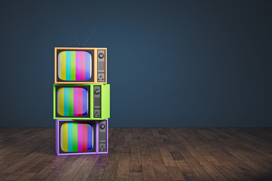 Obsolete rainbow TV pile