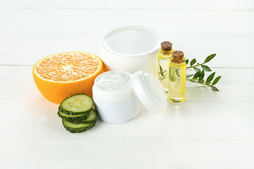 Spa concept with salt, mint, lotion, towel on white background
