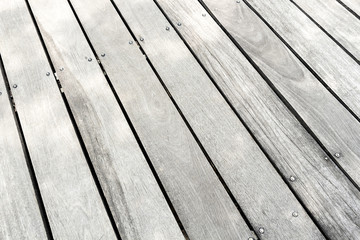 White wood texture or background plank with knots.
