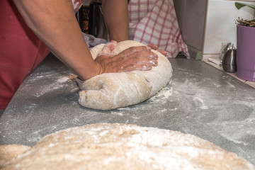 Bread in a traditional way, homemade, bake bread in wooden oven