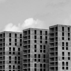 Fototapeta premium Grey buildings and sky. Black and white photo.