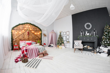 Space in the Photo studio with daylight. Christmas decorations.