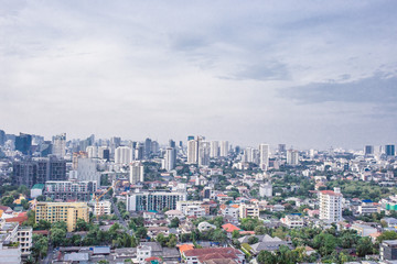 Fototapeta na wymiar city buildings with blue sky Asok Bangkok Thailand
