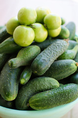 Still life of cucumbers and other vegetables