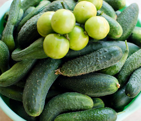 Still life of cucumbers and other vegetables