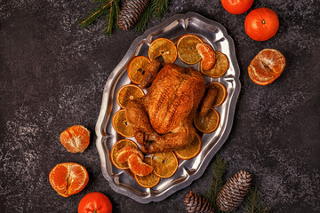 Roasted whole chicken with Christmas decoration.