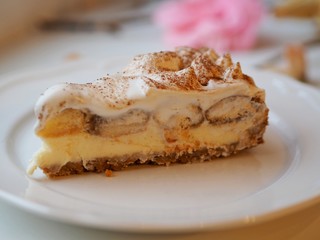 Cheesecake tiramisu with Savoiardi biscuits and cream with cocoa