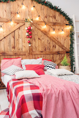 Xmas in morning bedroom. Double bed In christmas Interior on wood wall background