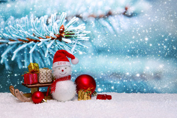 Fototapeta na wymiar Happy New 2018 Year background with Snowman and Christmas gifts.