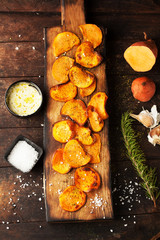 Sweet fried potatoes with spices, salt and sauce
