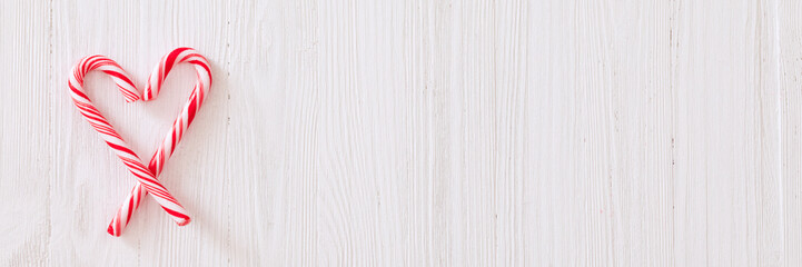 Christmas candy cane white wooden textured background